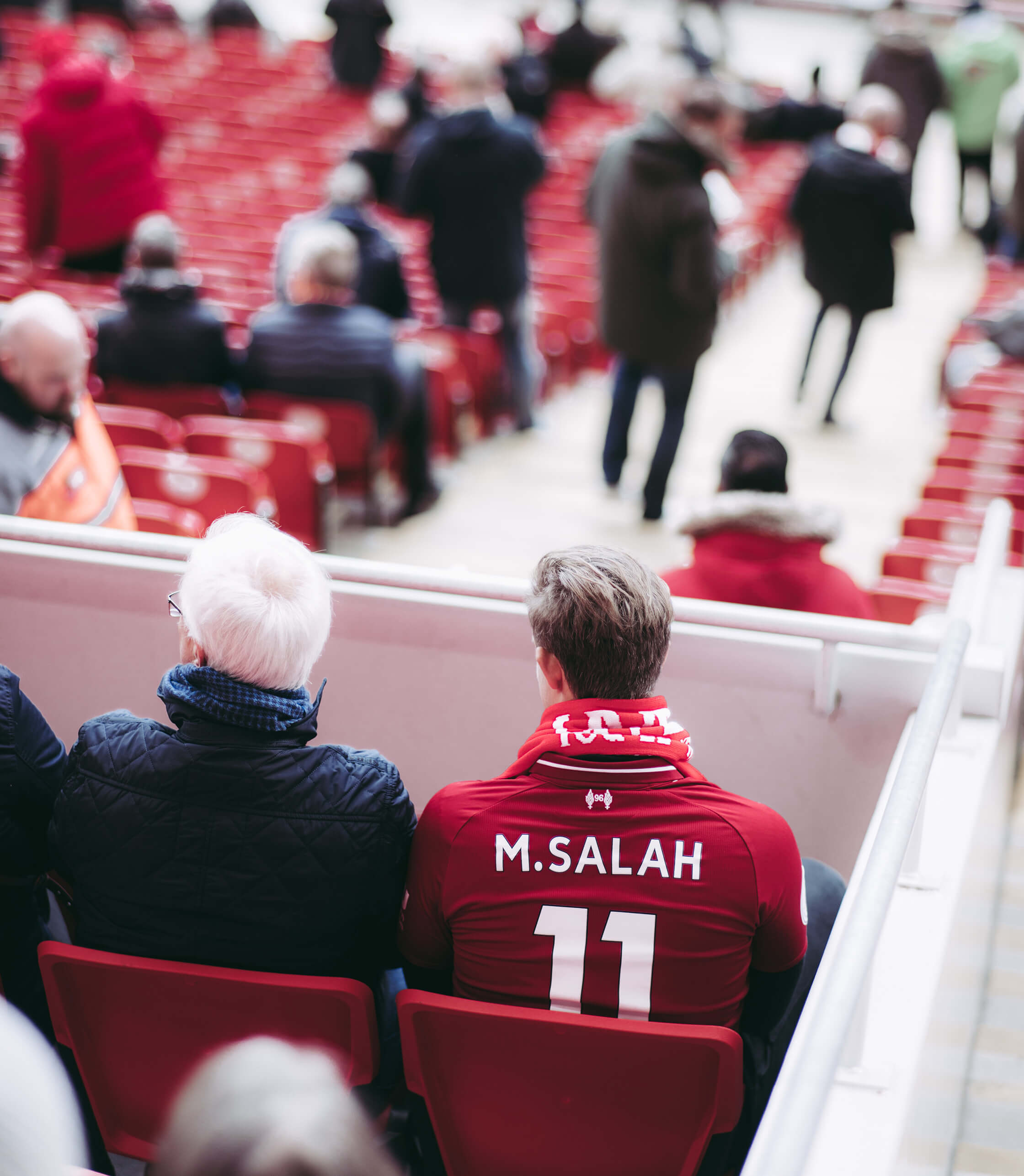 Football Fan In Liverpool Kit In Stadium