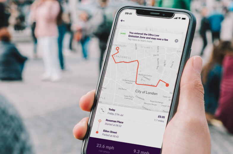 By Miles app Ultra Low Emissions Zone London Warning in Hand